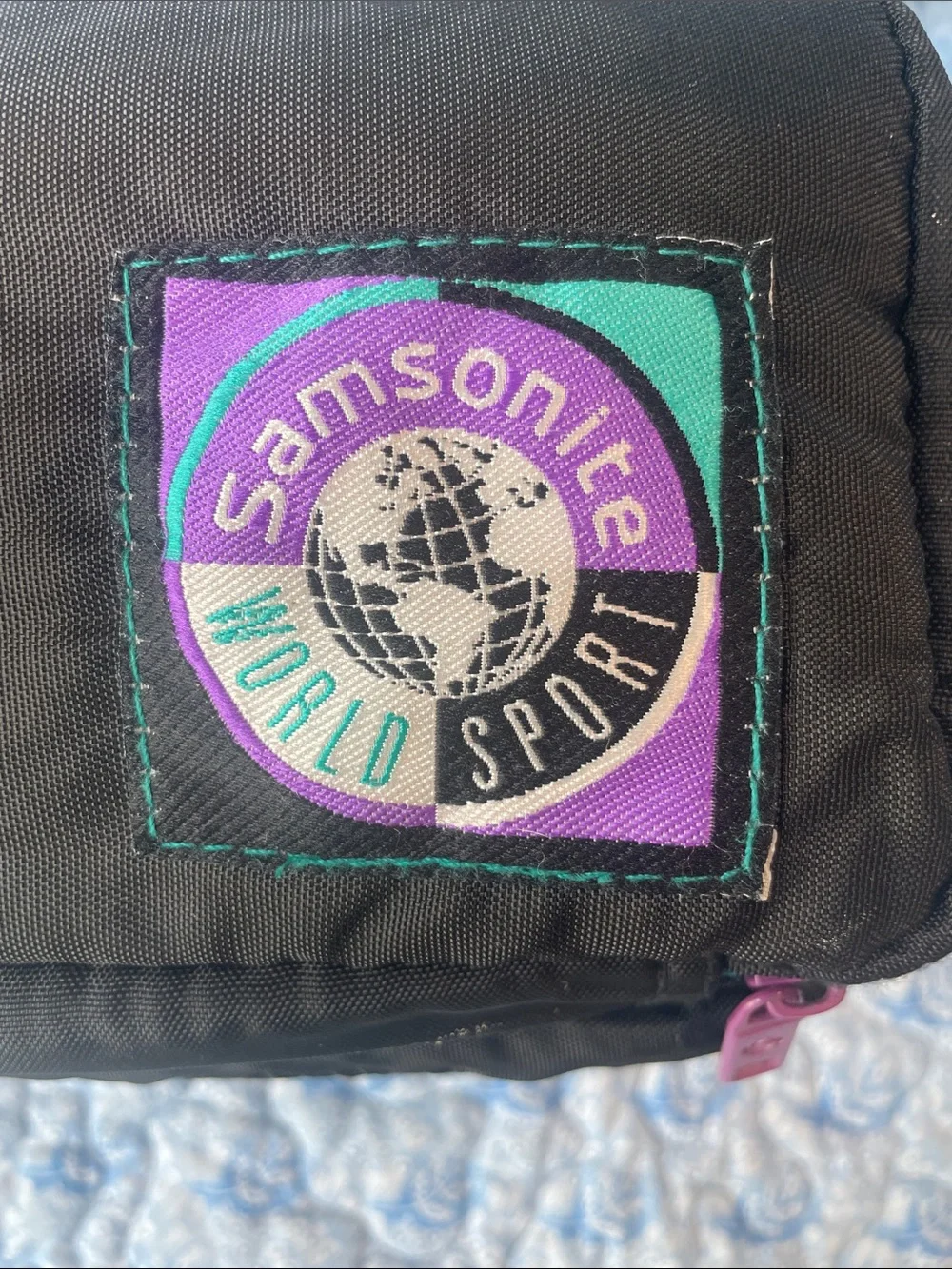 Samsonite Black Bag with Purple and Teal Logo Patch